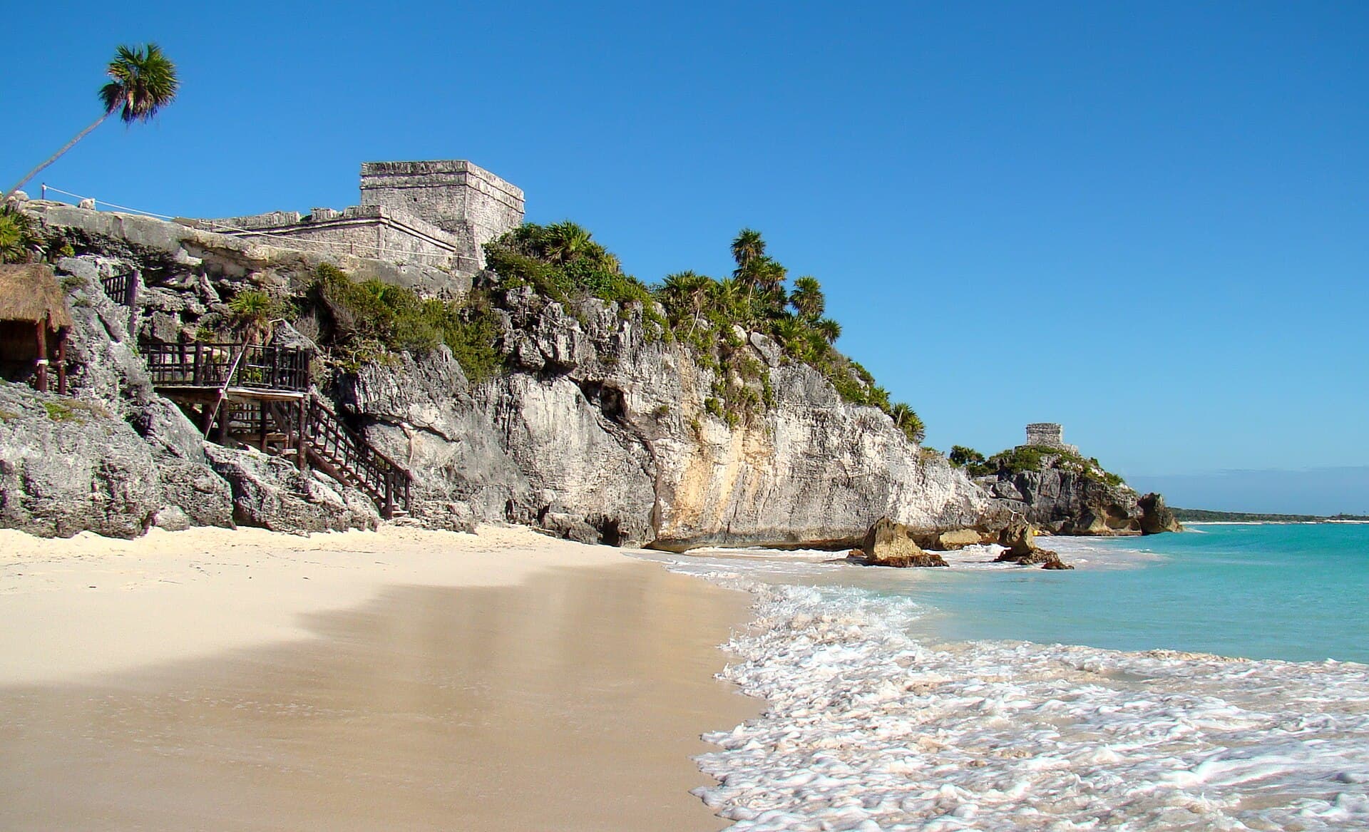The beach below the Maya ruins at Tulum, with the castle on the cliff